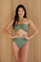 Front view of model wearing Isla High Waist bottom in agave color