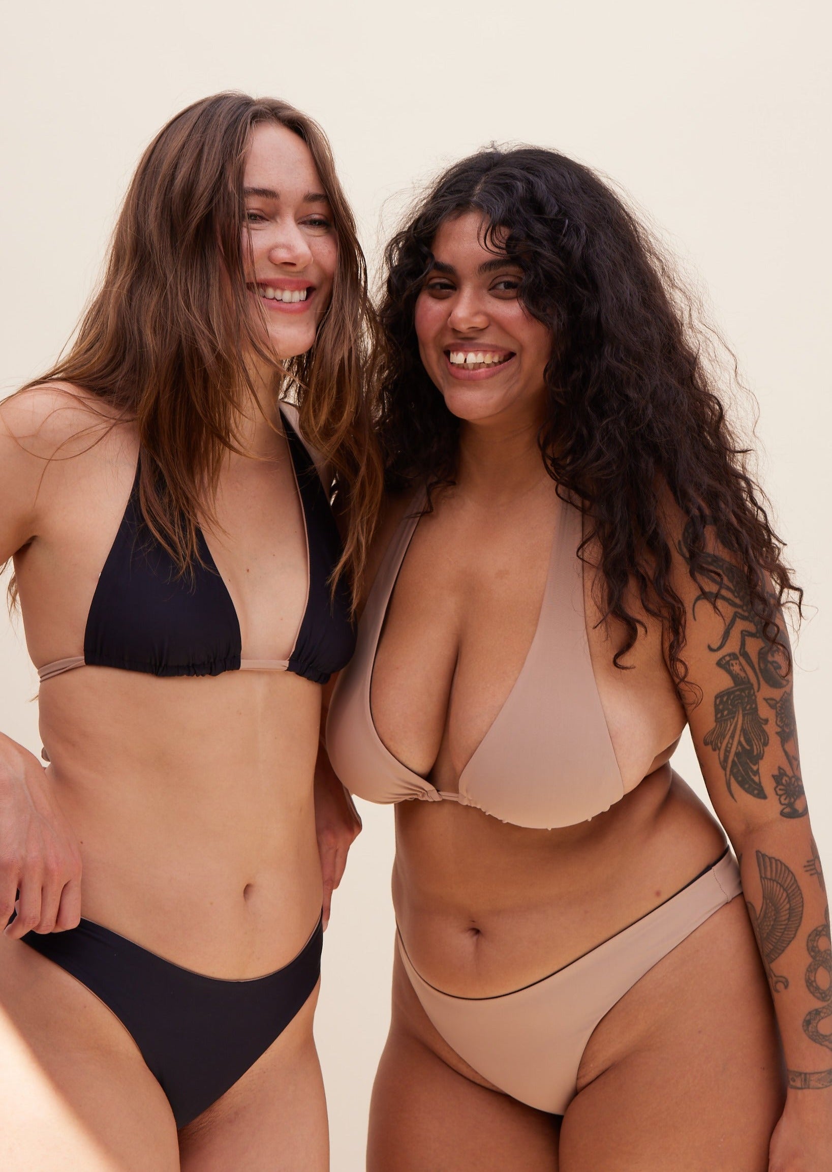 Front views of models wearing Reversible Koloa Top in dune color. Showcasing both tan and black styles